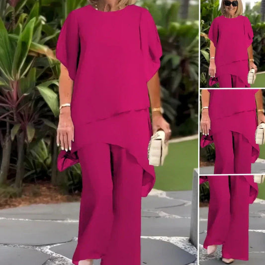 Charmerende sæt med uregelmæssig top og bukser med brede ben – asymmetrisk kant, flagrende dobbeltlag og elegance hele dagen 👗✨