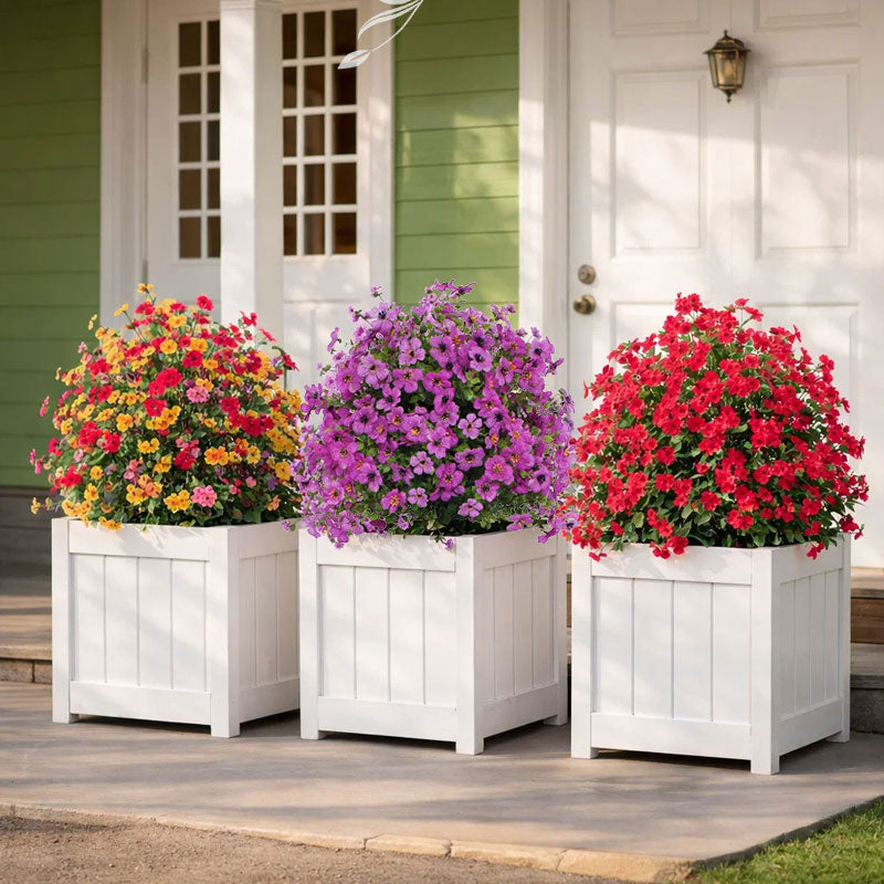 Blomsterdekoration med kunstige eukalyptus- og violer, der stikkes ned i jorden