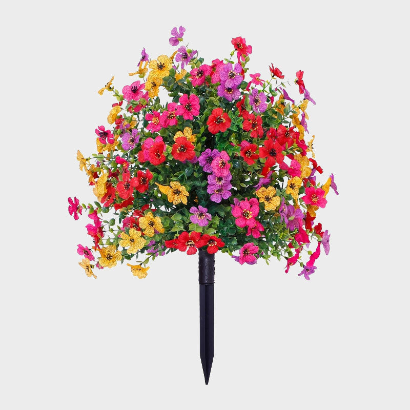 Blomsterdekoration med kunstige eukalyptus- og violer, der stikkes ned i jorden